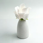 White blooming rose lamp glowing