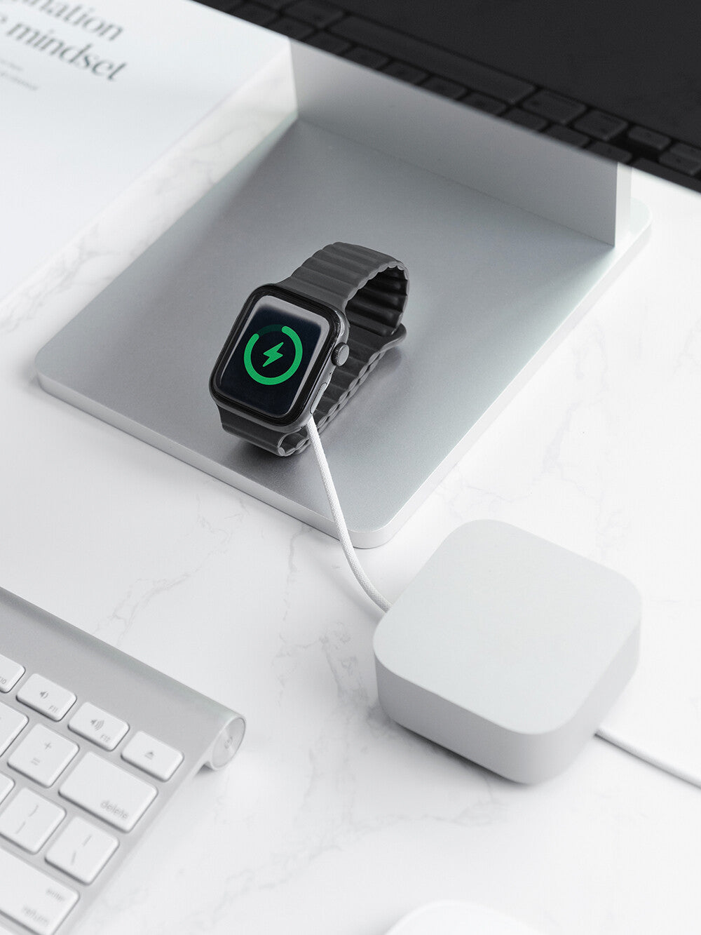 KOKOGOL Cube Mini Cable Organizer on white desk with Apple Watch charging and iMac keyboard in background