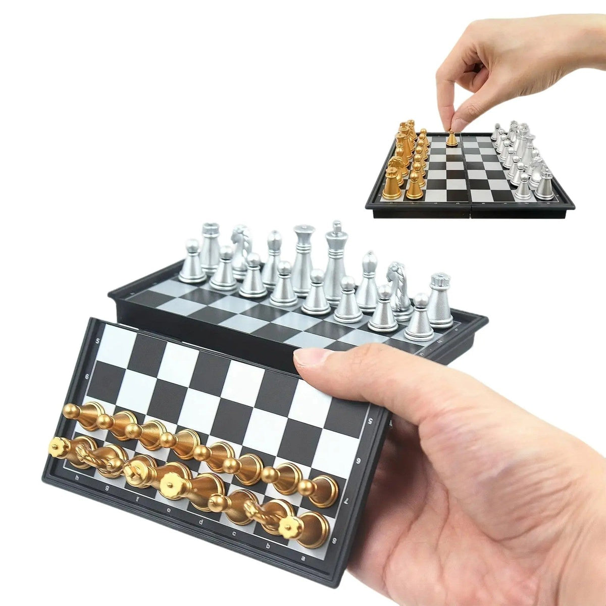 Mini magnetic chess set — hand holding the folding board, gold and silver pieces set up