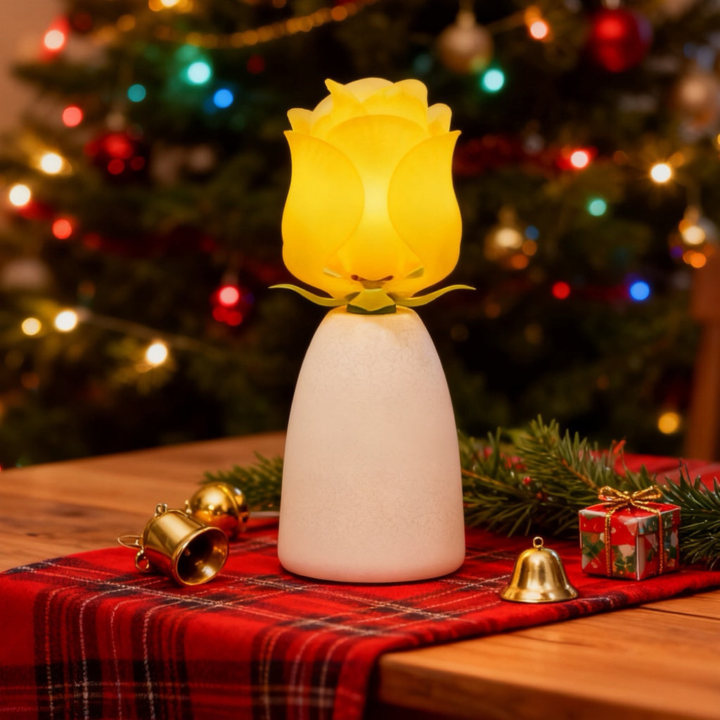 Yellow blooming rose lamp by a Christmas tree