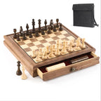 Black walnut magnetic chess board with Staunton pieces set up and storage drawer open